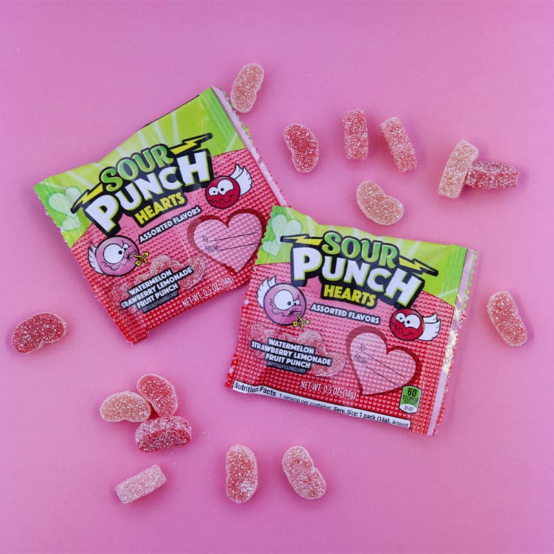 SOUR PUNCH Hearts valentine candy share pouches on light pink background