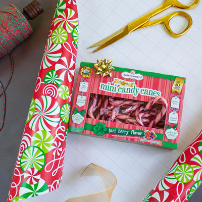 Torie & Howard Organic Mini Candy Canes box being wrapped as a gift
