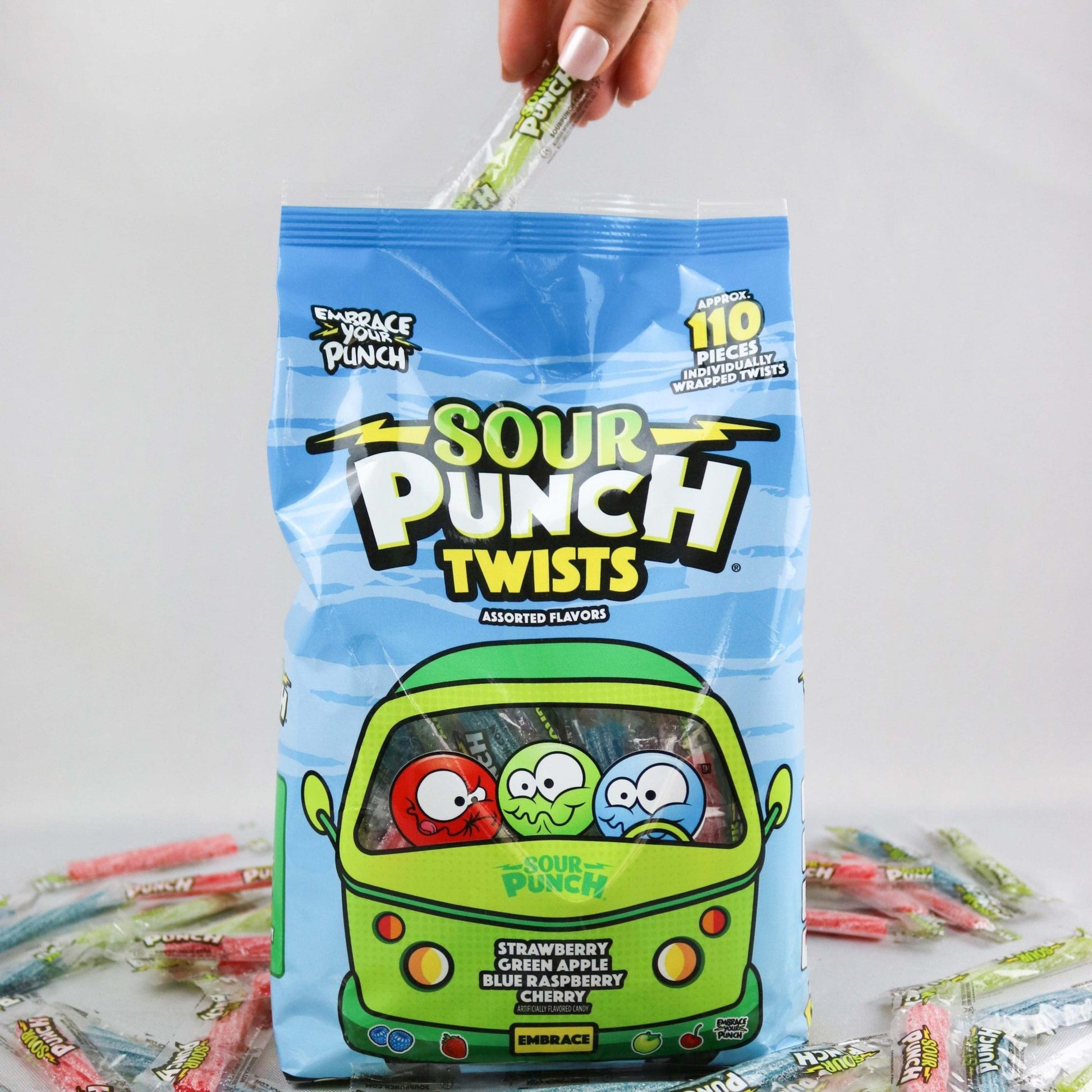 Hand reaching into bag to grab a SOUR PUNCH Individually Wrapped Candy Twist