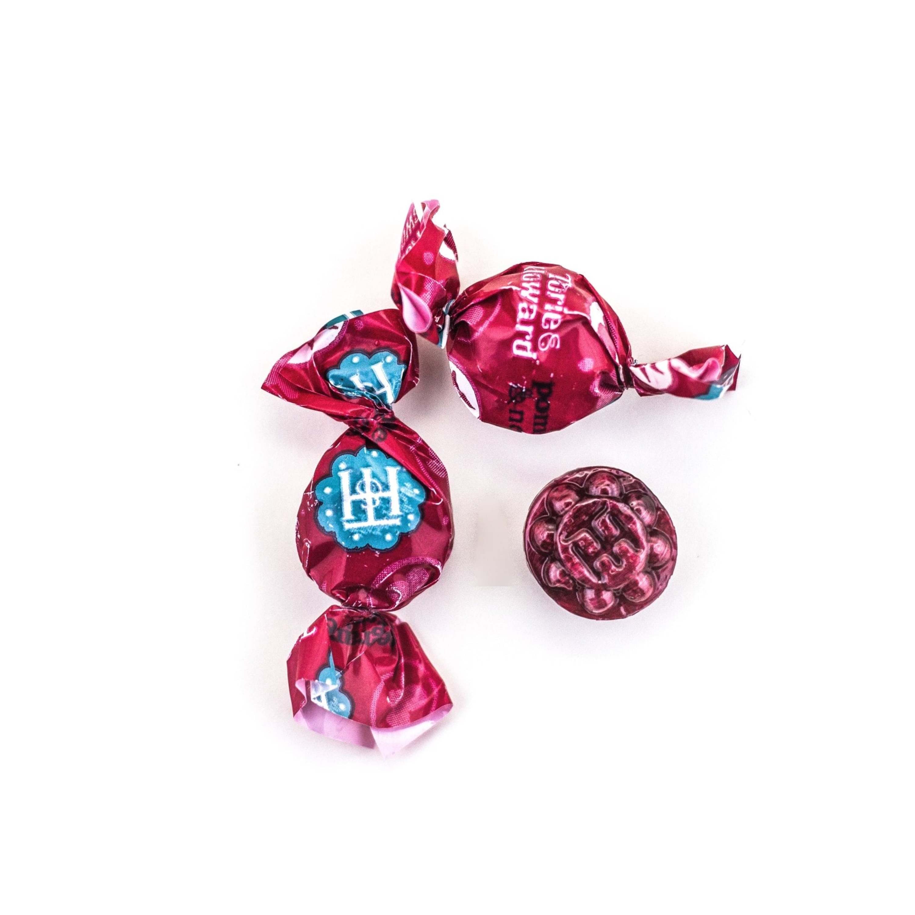 Wrapped and unwrapped Pomegranate & Nectarine Organic Hard Candy pieces