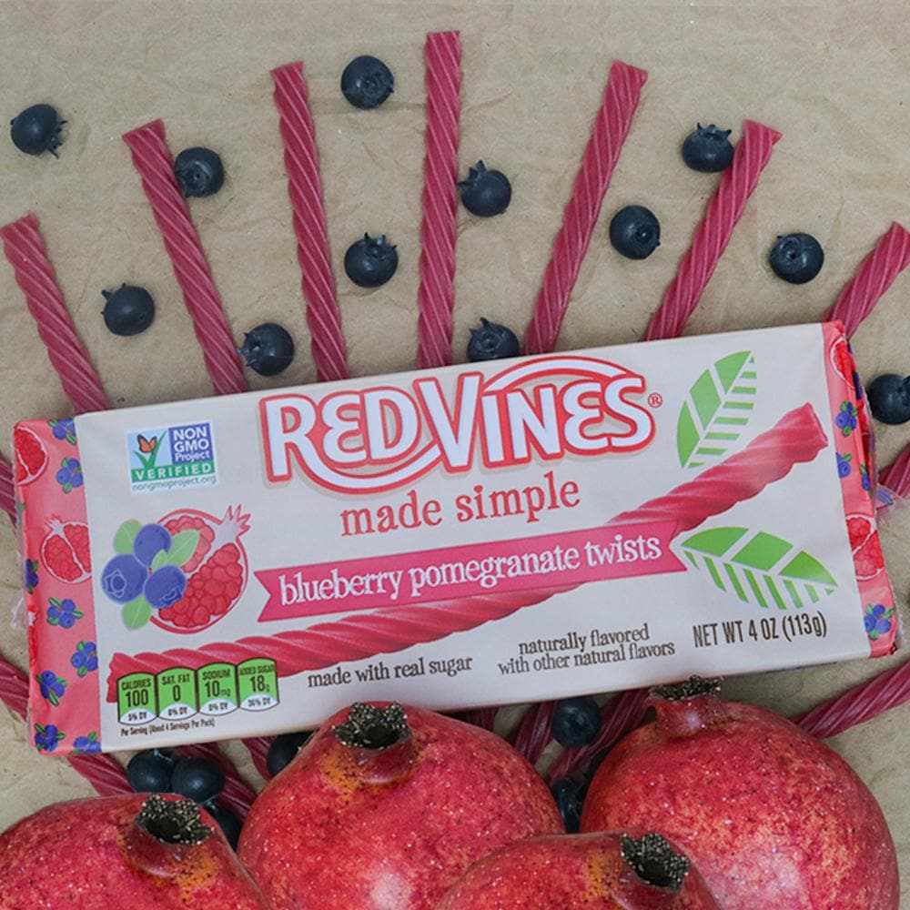 RED VINES Made Simple Blueberry Pomegranate Twists 4oz Tray with fresh fruit and candy licorice