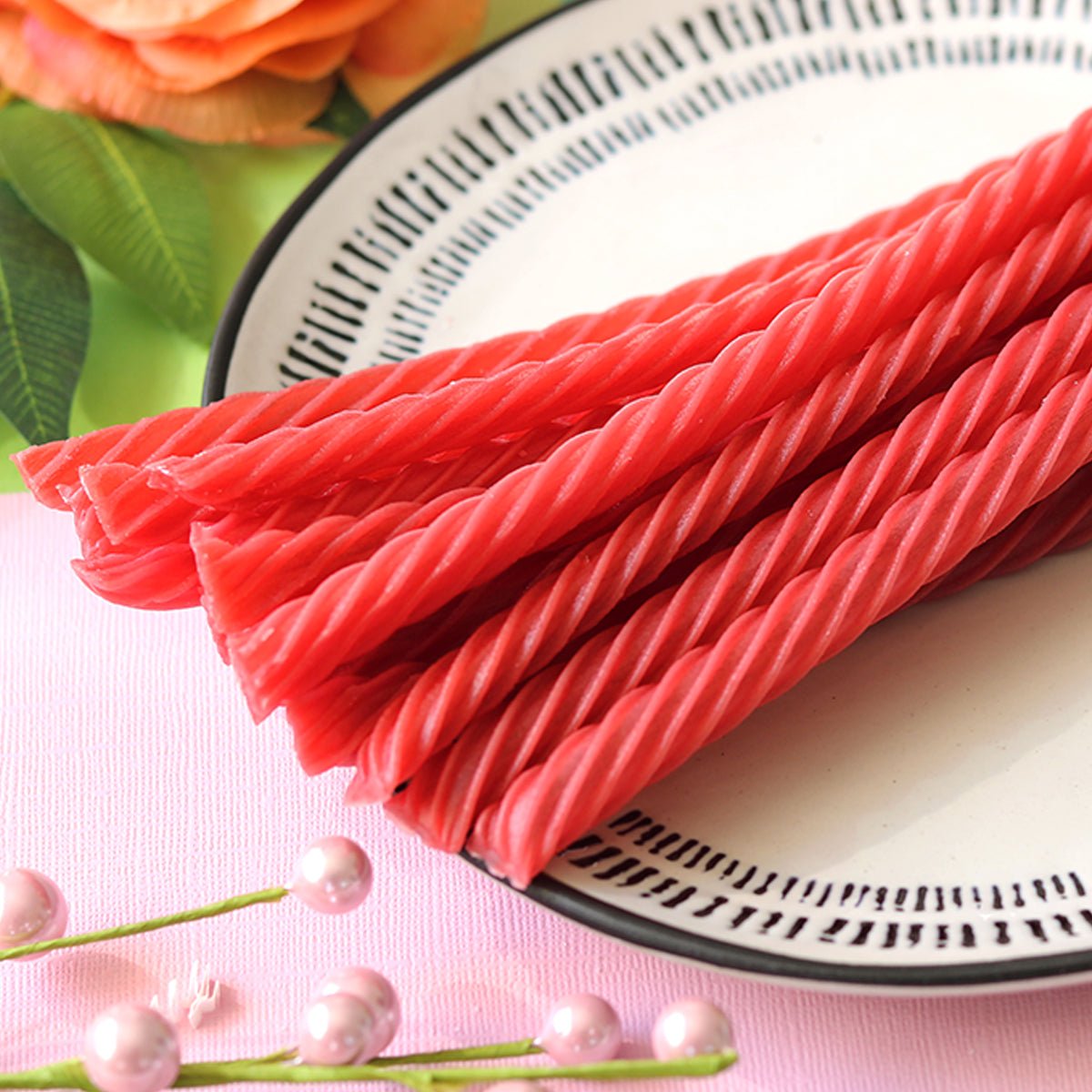 RED VINES Made Simple Cherry Twists on a plater with spring colors