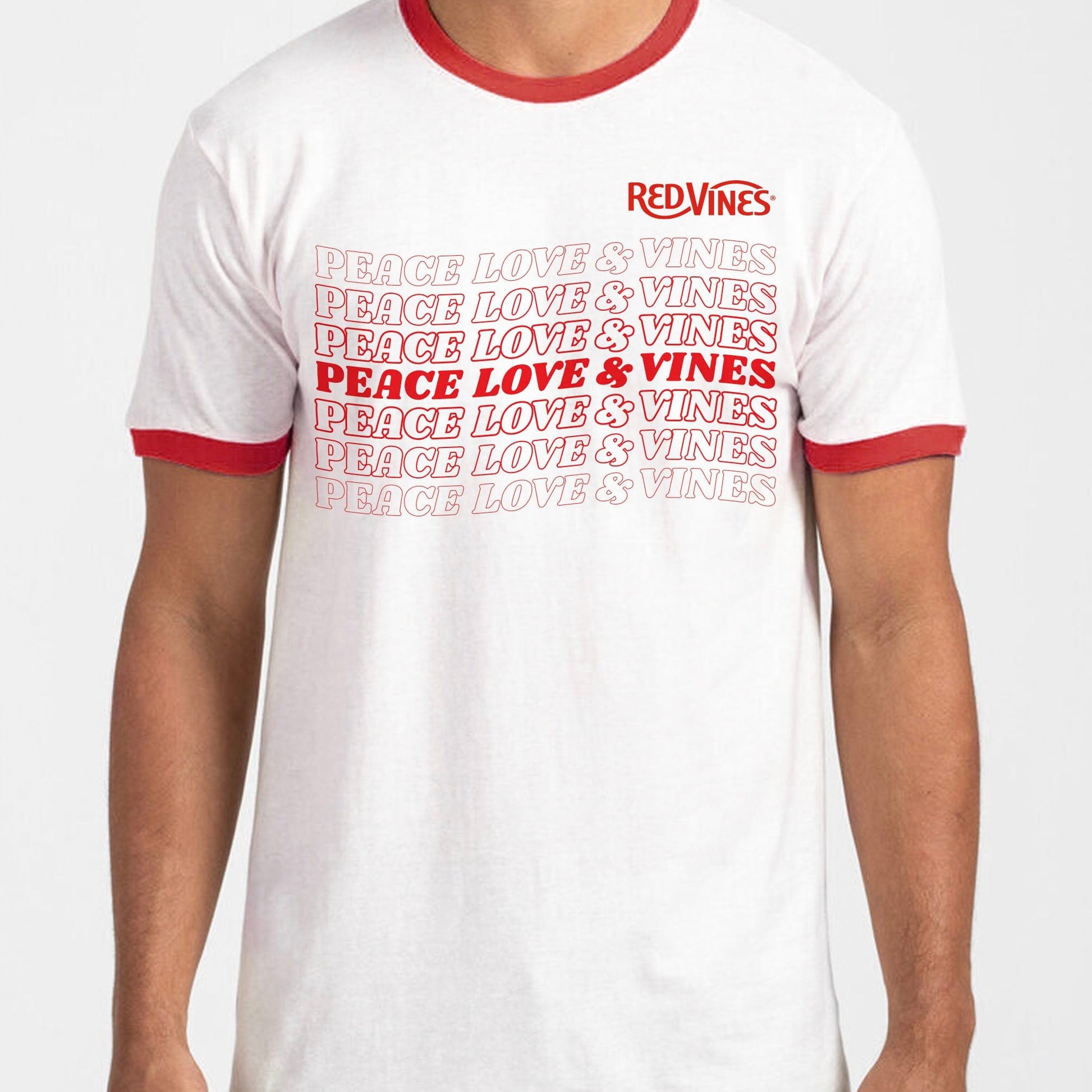 RED VINES Red and White Peace, Love & Vines T-Shirt with RED VINES logo in the upper left chest and written across the chest 7 times, faded in and out, "PEACE LOVE & VINES"