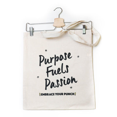Front of SOUR PUNCH Natural colored Tote Bag with black text, "Purpose Fuels Passion: EMBRACE YOUR PUNCH"