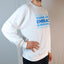 Side angle of white SOUR PUNCH Crewneck Sweatshirt with a relaxed fit